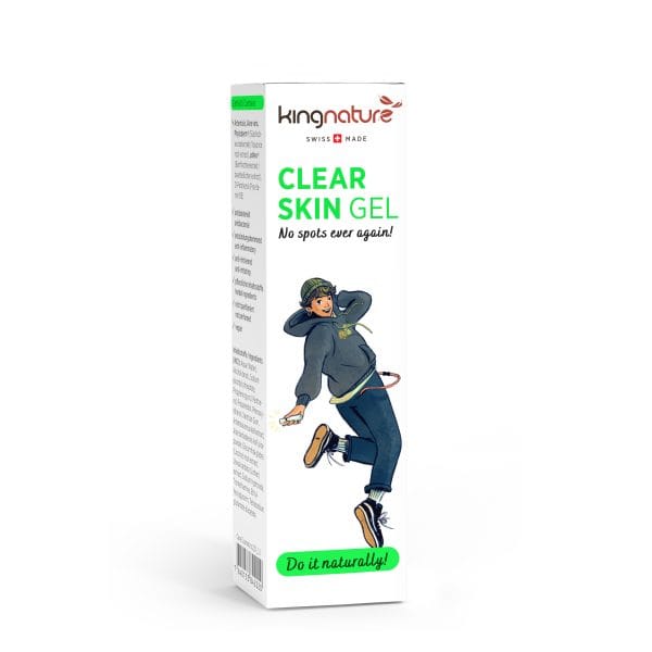 ClearSkinGel_Box_Front_WhiteBG Eine weiße Packung Kingnature Clear Skin Gel zeigt eine tanzende Person in Freizeitkleidung. Die Verpackung ziert die Aufschrift „Clear Skin Gel“, „Nie wieder Pickel!“ und „Natürlich!“. Das Swiss Made-Logo steht für vertrauenswürdige Qualität.