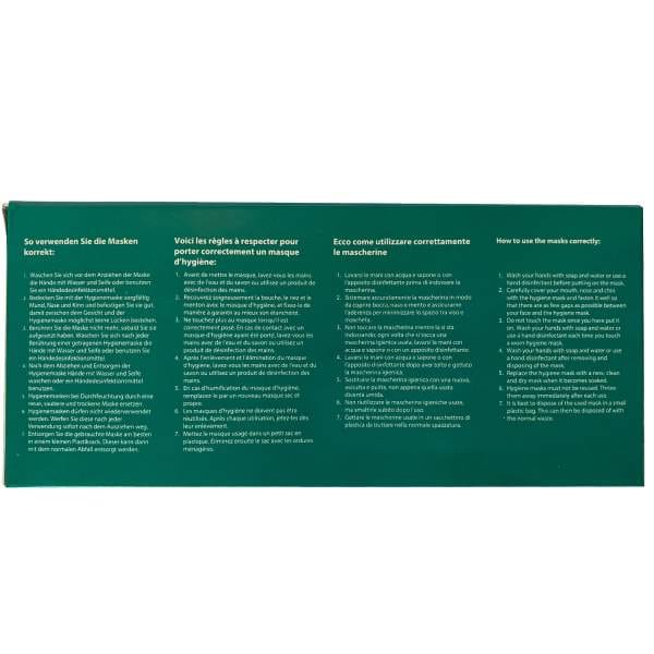 Auf den OP Gesichtsmasken Typ IIR (50 Stk.) ist in einem grünen Kasten eine Gebrauchsanweisung in Deutsch, Französisch, Italienisch und Englisch (weißer Text, separate Spalten) abgebildet; die englische Spalte trägt die Überschrift „So verwenden Sie die Masken richtig“.