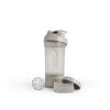 Auf weißem Hintergrund ist ein transparenter Shaker „Blender Bottle Prostak Pro“ mit Schraubdeckel, Mixkugel aus Metall, zwei herausnehmbaren Fächern und kingnature-Etikett abgebildet.